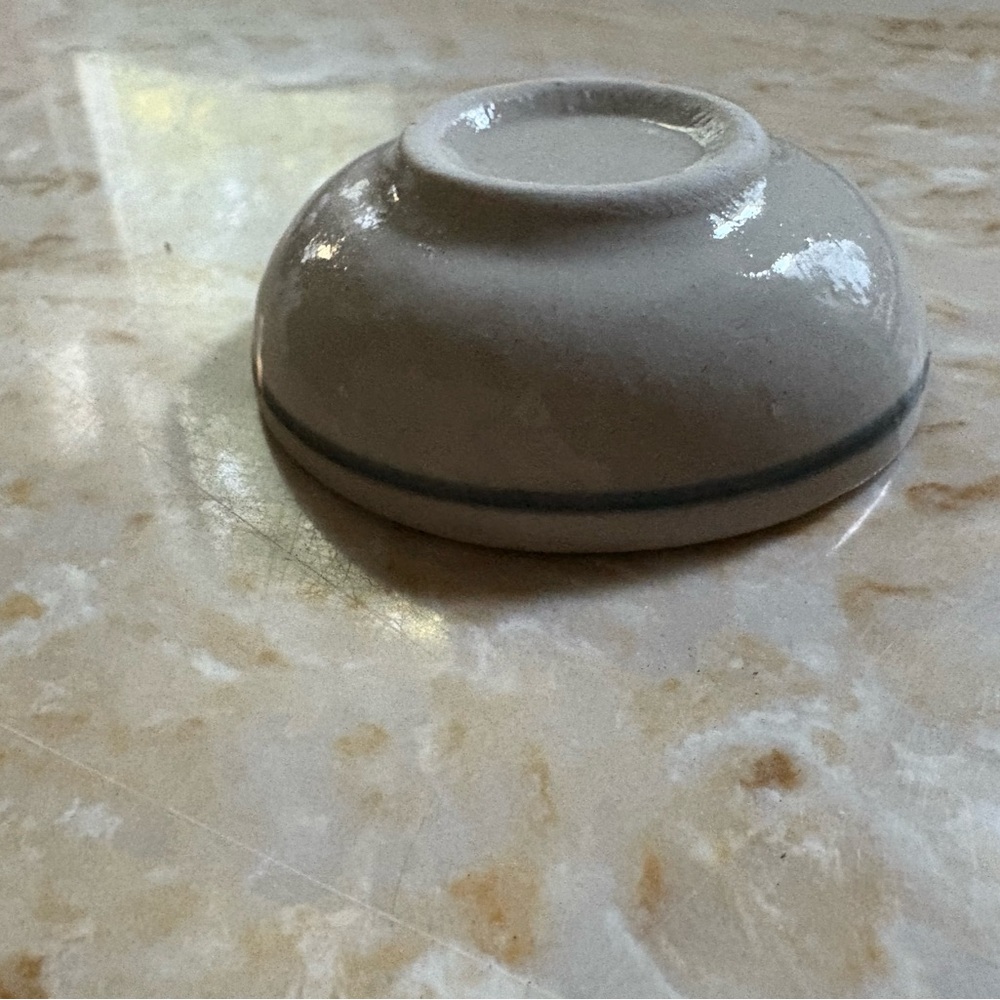 25 lovely Cream Ceramic Bowls with a navy stripe. $3 each